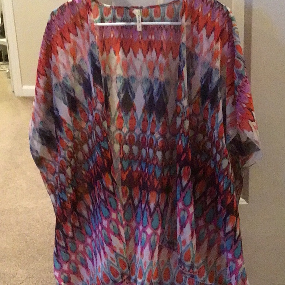Sheer, multi colored top.  Worn with camisole.
